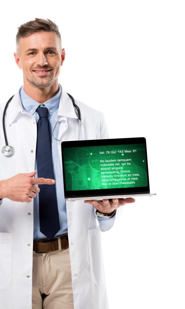 handsome doctor pointing at laptop with health data on screen isolated on white